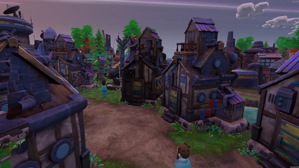 Damaged buildings stand along a settlement road in an official development-build screenshot.