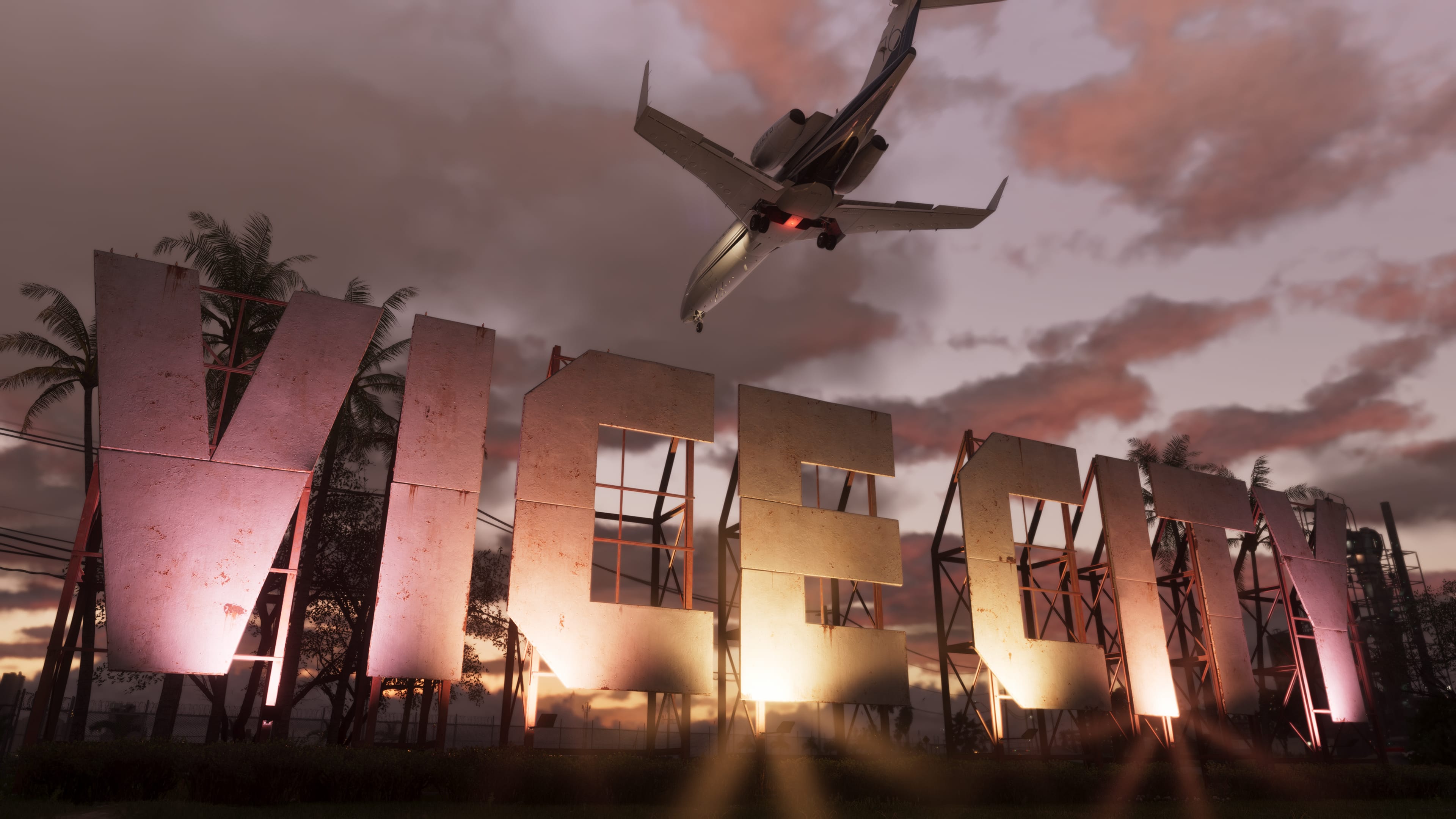 An aircraft passes above the illuminated Vice City sign in Rockstar’s official GTA VI screenshot