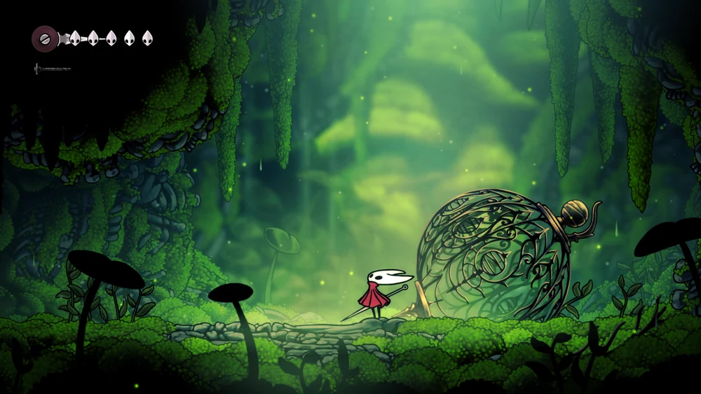 Hornet stands beside an ornate cage in a green grotto.